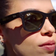 A model wears the Wayfarer version of Ray-Ban Stories.
